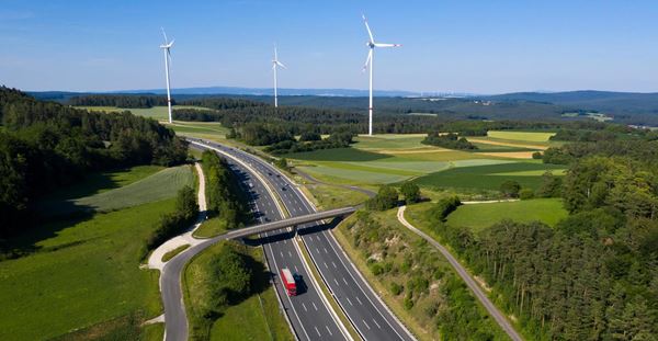 Trucks on Highway and Wind Turbines, Aerial View