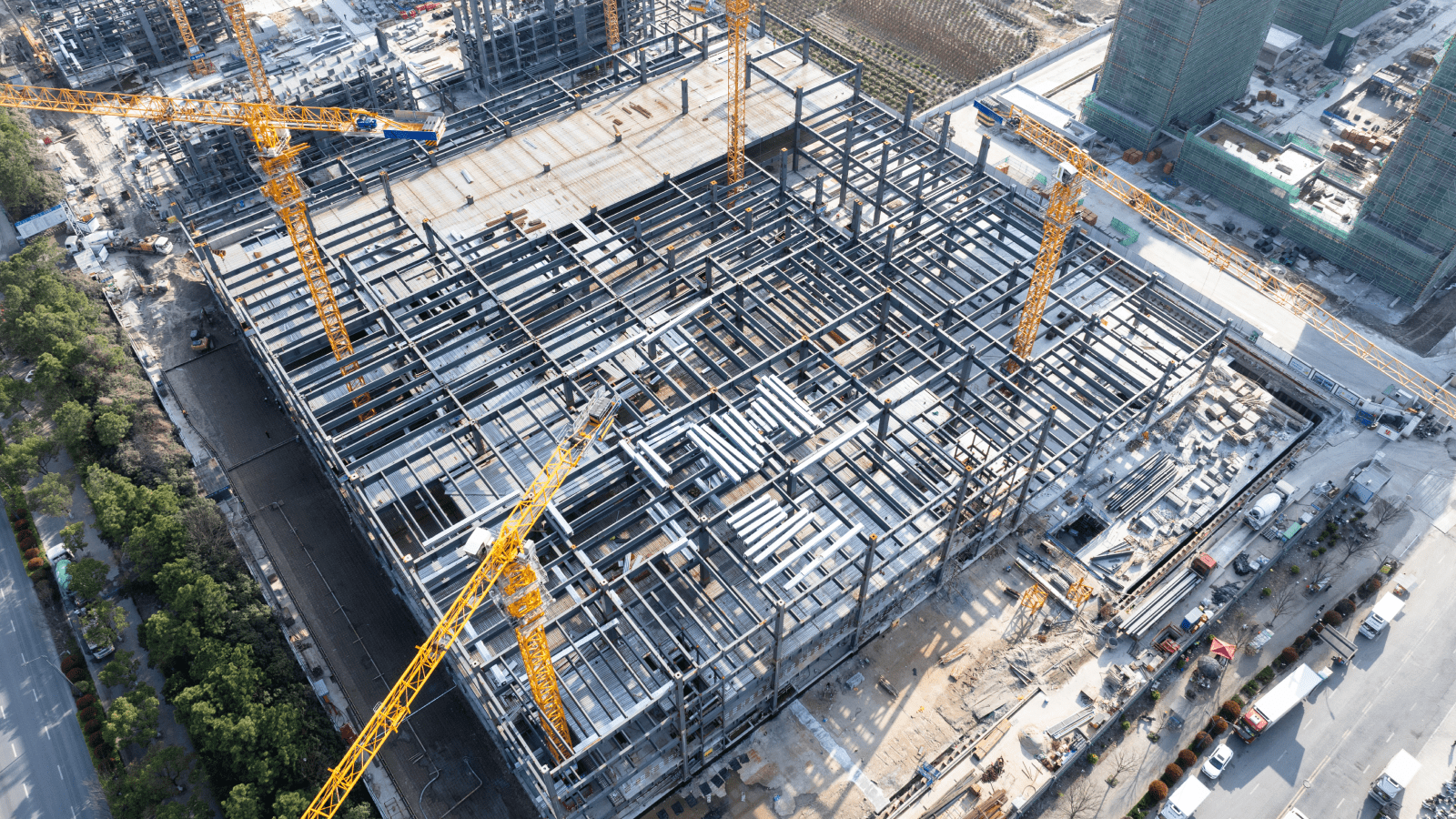 Aerial view of construction site with cranes.