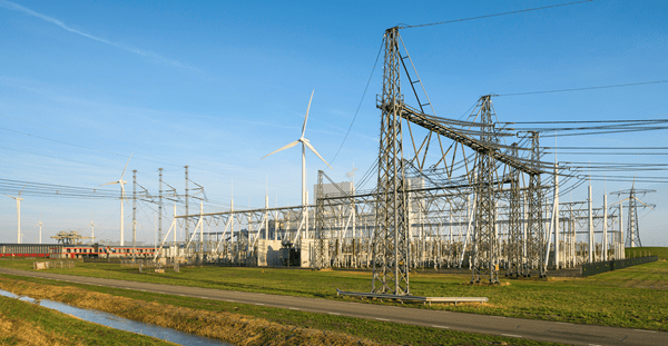Wind turbines near power lines and transformator substation