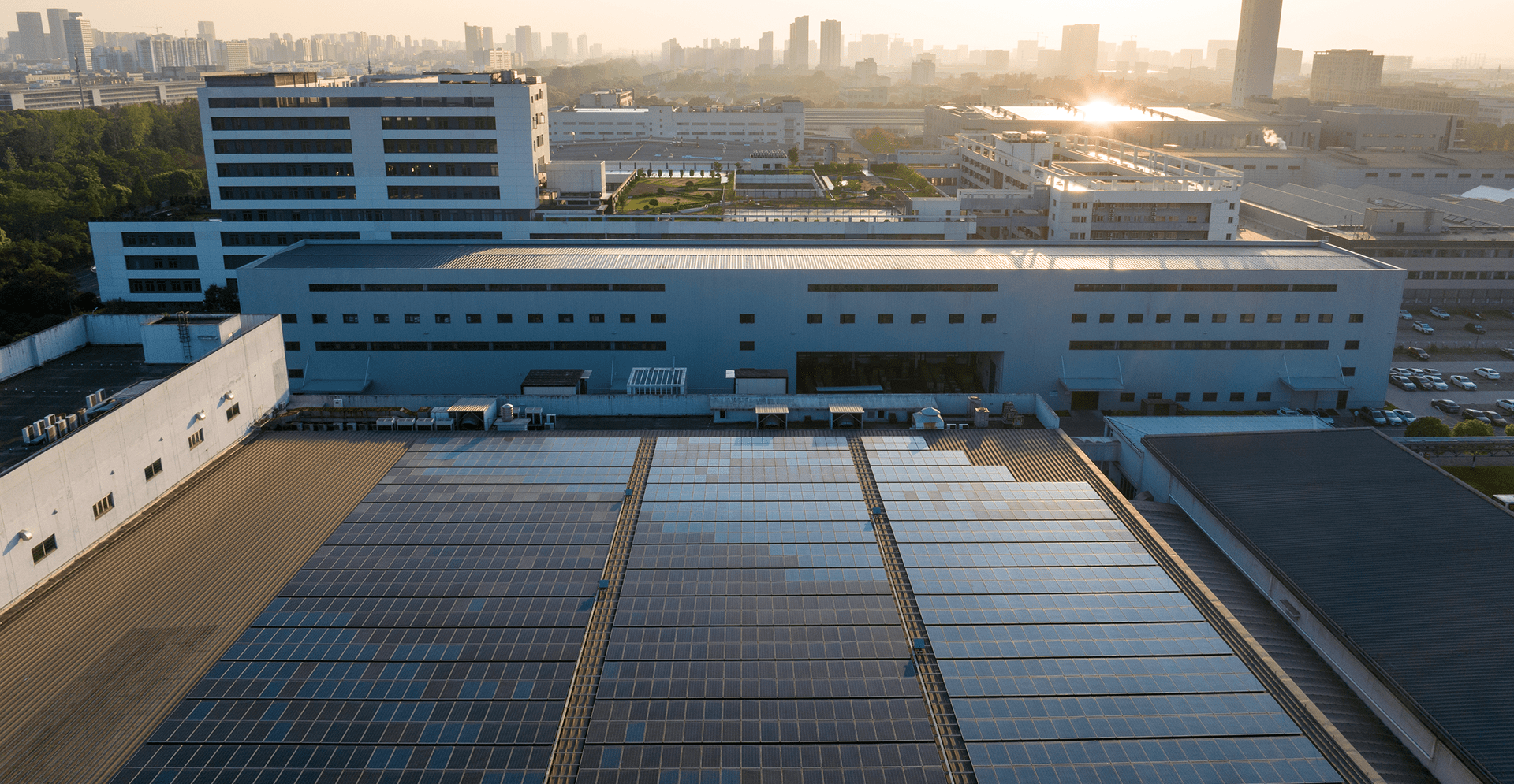 A prominent building with solar panels on the roof, highlighting its commitment to renewable energy.