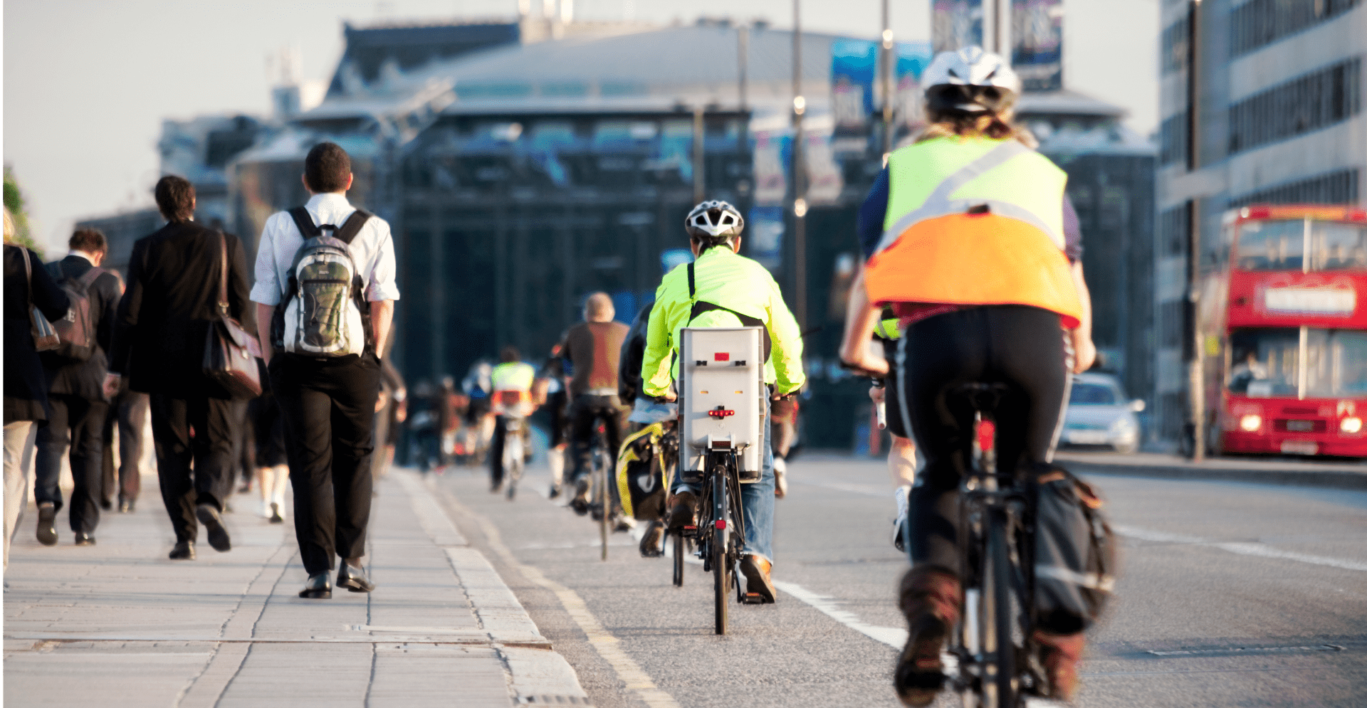 A cyclist riding through the bustling streets