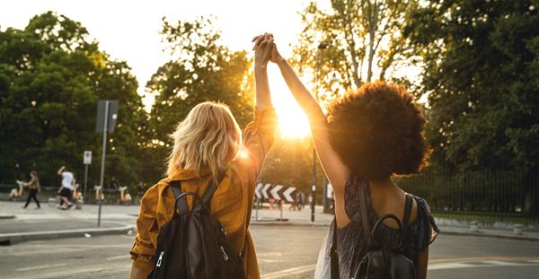 6 Things You Can Do Right Now to Support Gender Equity Girls walking, holding hands above their heads