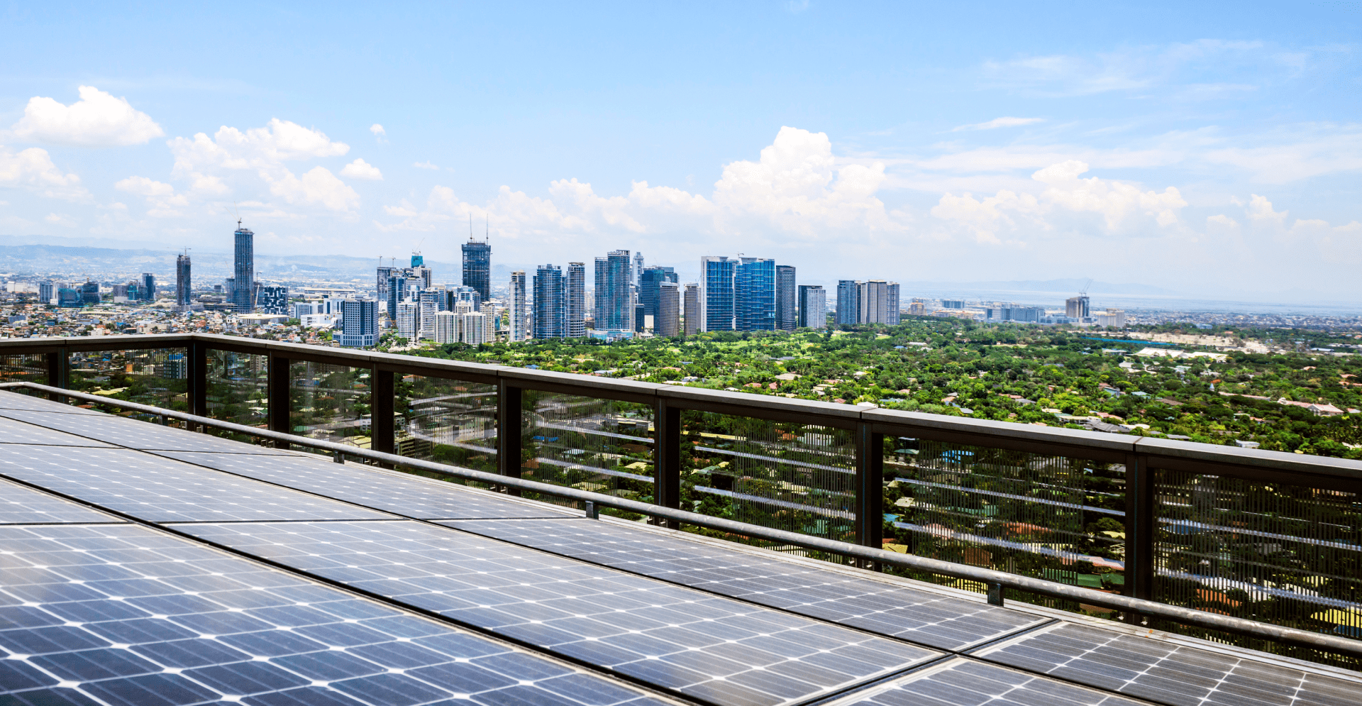 Renewable energy source on rooftop with urban view.