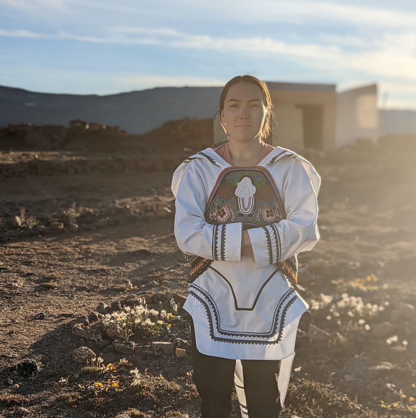 Andrea Anderson standing on mountainous terrain.