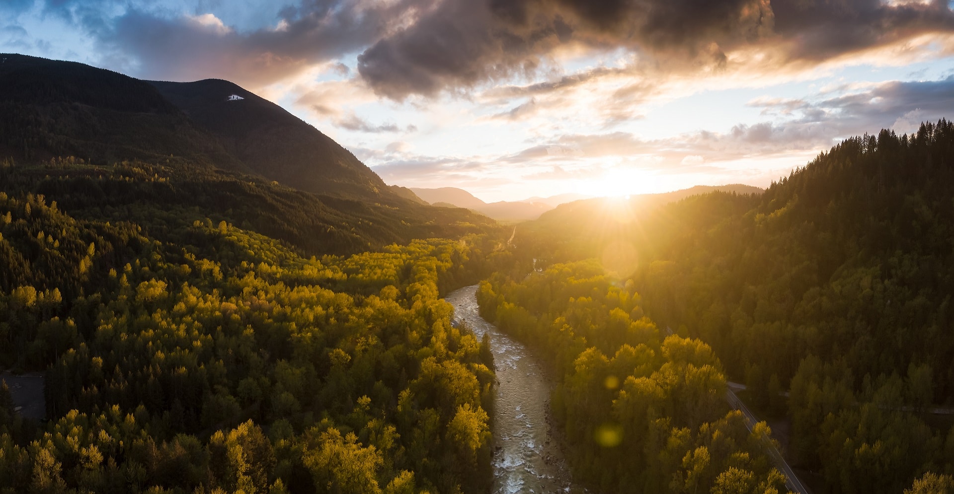 Aerial panoramic view of a valley at sunset near Chilliwack, Vancouver, British Columbia, Canada.