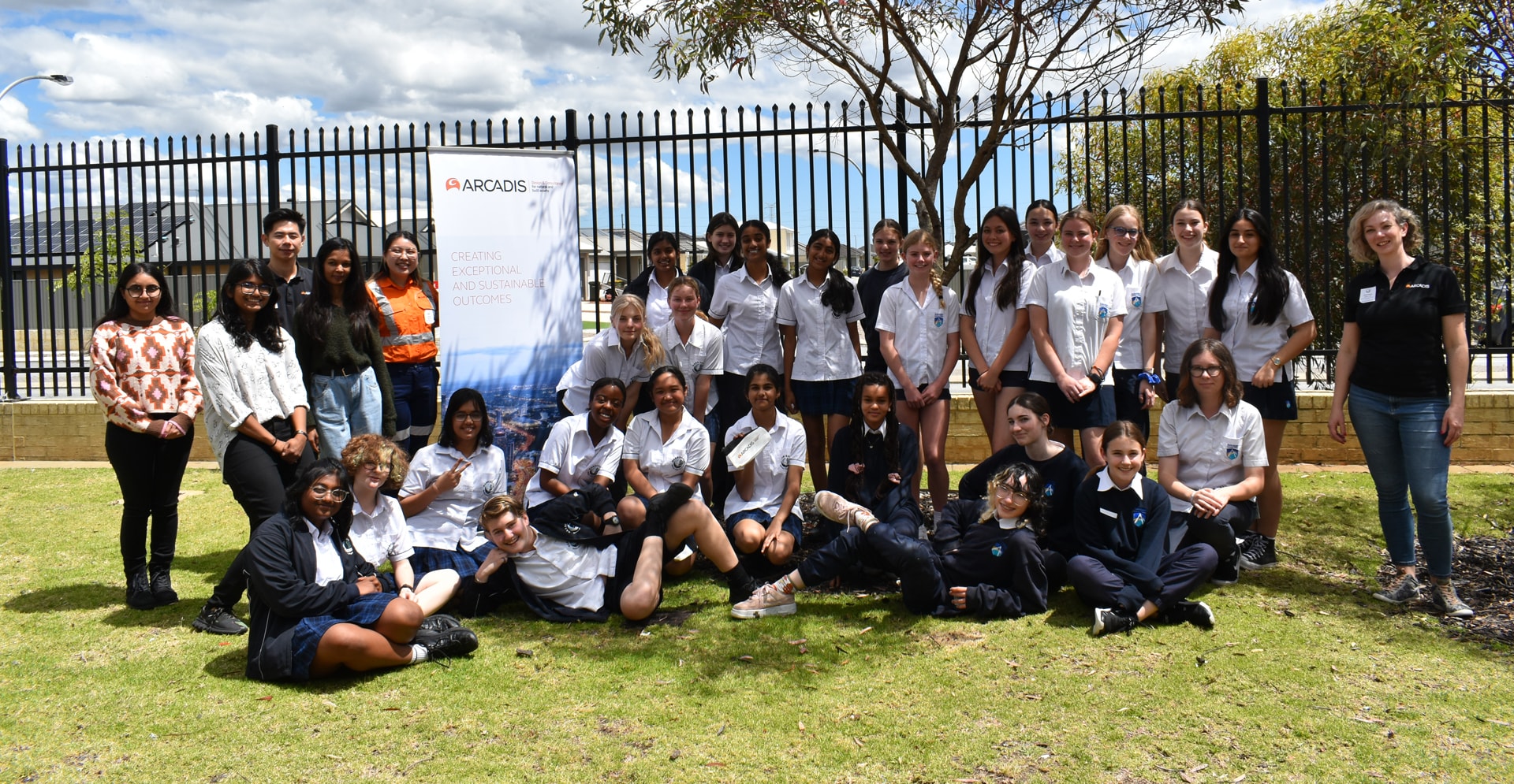 A group of people smiling and posing with for a photo.