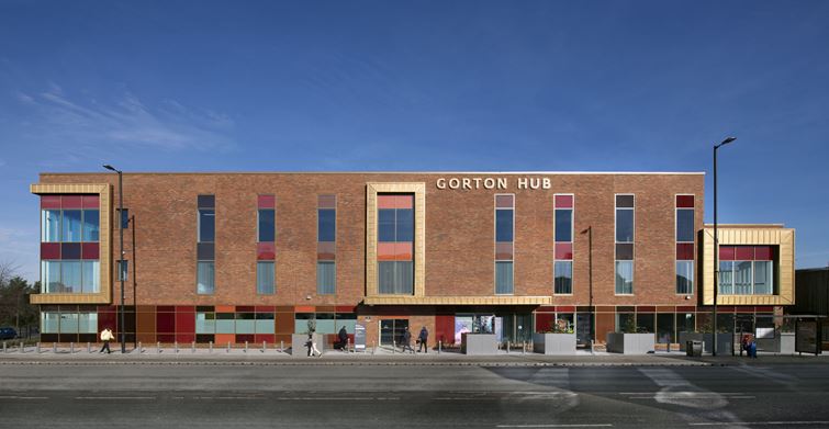 Gorton Hub showcasing its red brick front view. Credits to Positive Image Photography