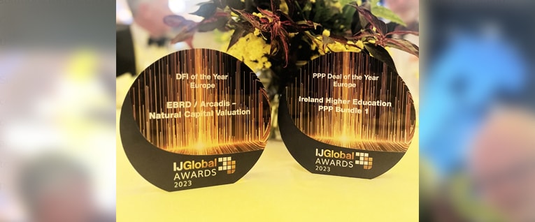 A pair of awards for natural capital risk assessment on a table