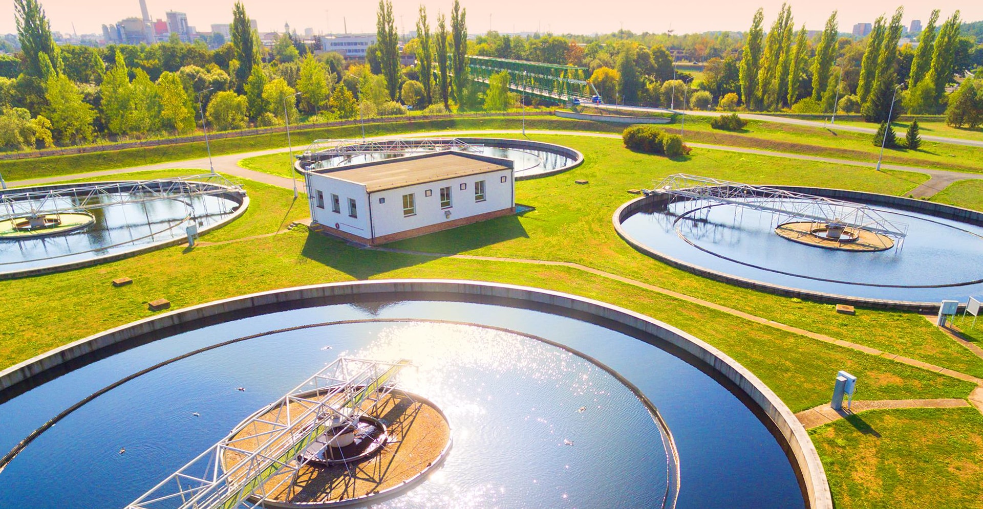 A water treatment facility with several large tanks designed for the treatment and filtration of water.