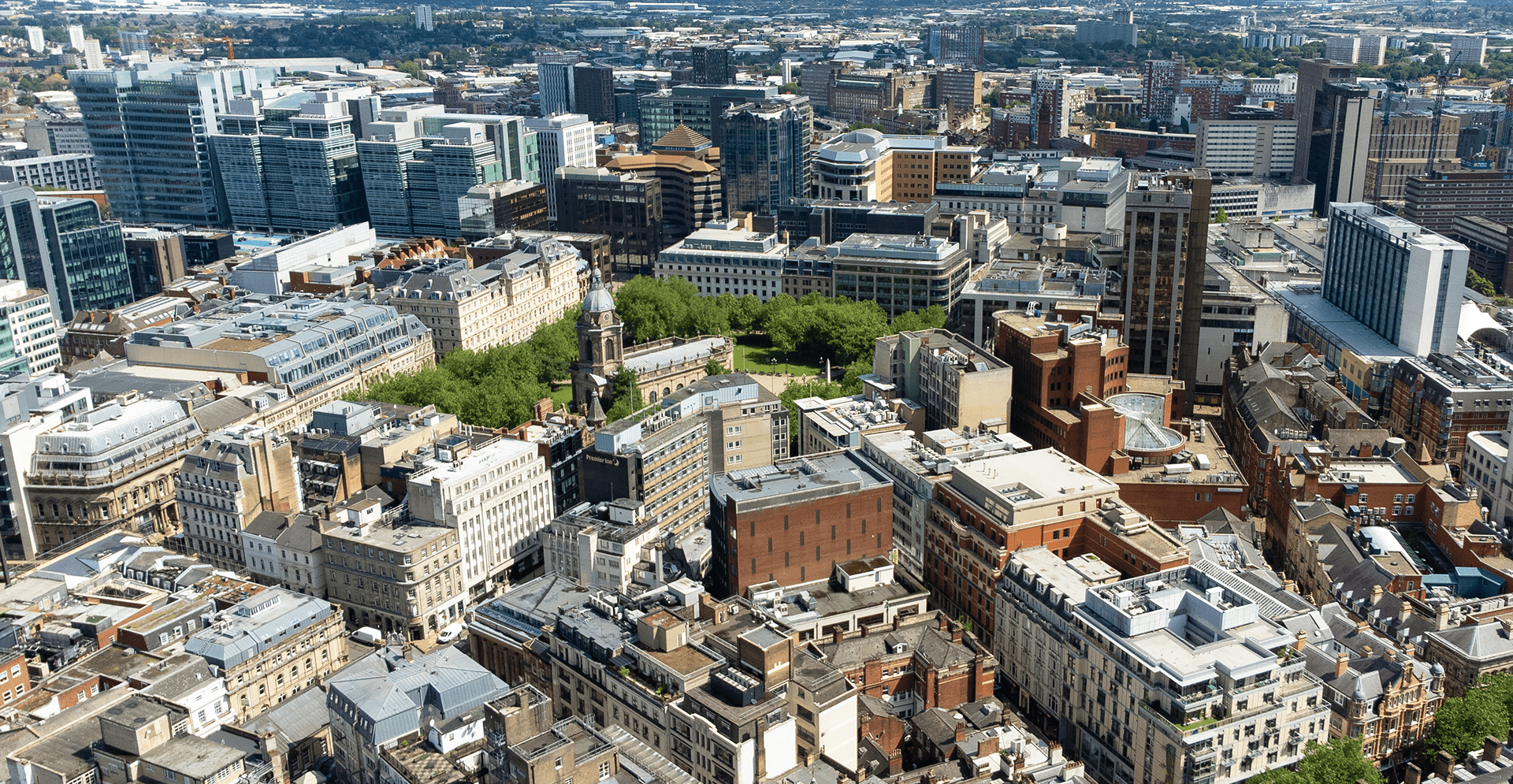 Aerial view of London city showcasing iconic buildings and streets from the top of a high-rise building.