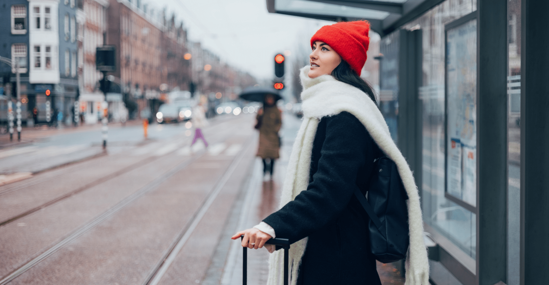  Woman in Winter Outfit Waiting at Bus Stop in Urban City Setting