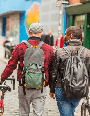 Men with bicycles in the city in the Temple Bar district of Dublin, Ireland
