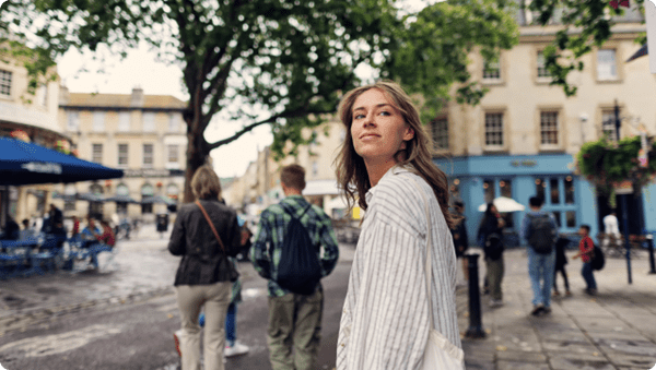Family sightseeing Bath walking in the town square.