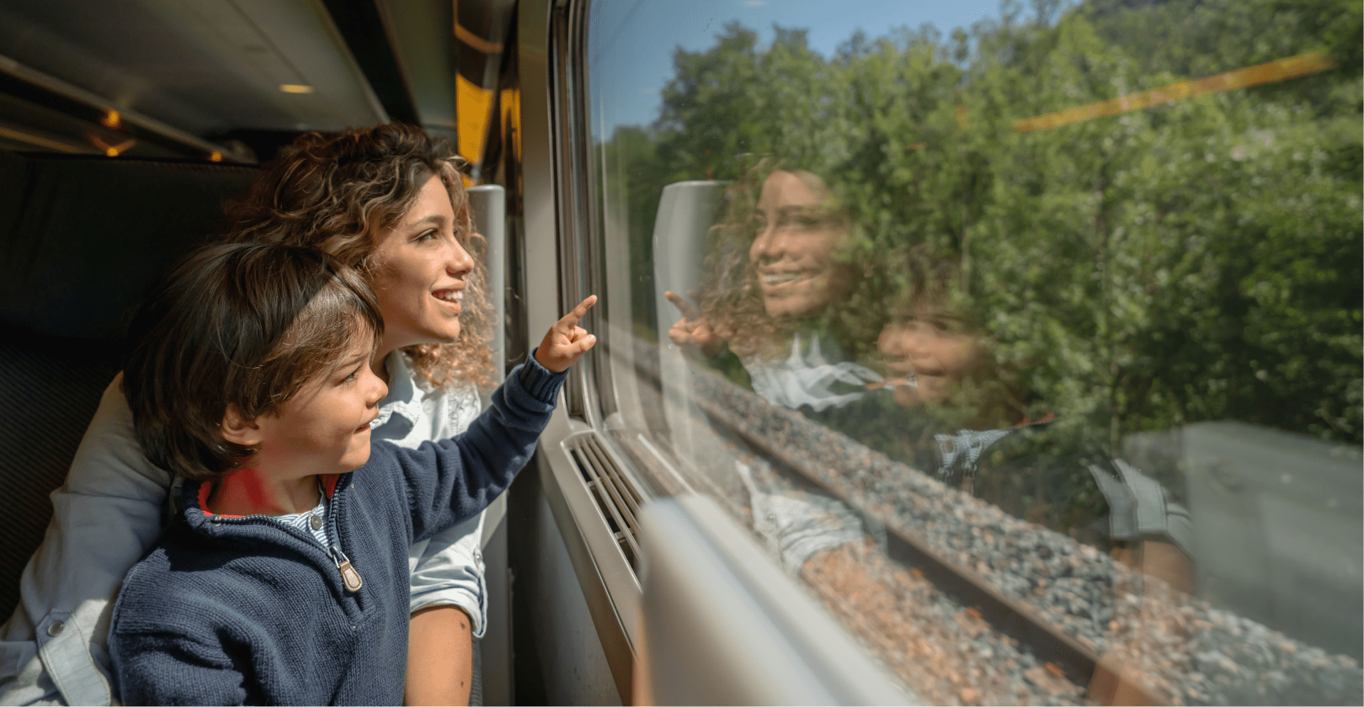 Family inside a training looking at the window