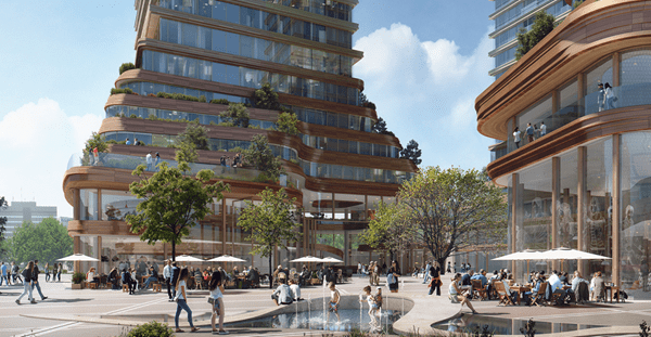 District E nieuwe stationsomgeving in Eindhoven Visualisatie van stationgebied met rechts een gedeelte van één van de torens en achter in beeld een tweede toren