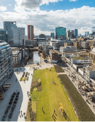 Aerial view of Amsterdam, capital of the Netherlands, showcasing its iconic canals and historic architecture.