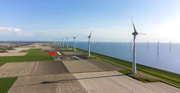 Driving climate action through net zero decarbonization planning Wind turbines on the seaside farm