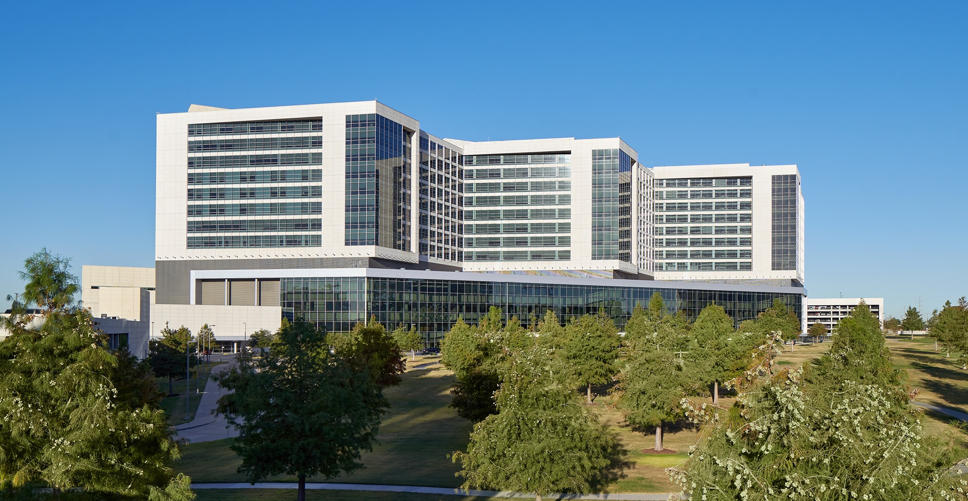 A large building featuring numerous windows, showcasing a modern architectural design and ample natural light.